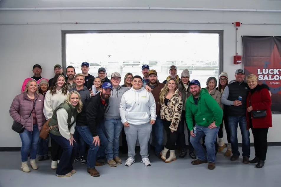 Group photo in front of ice