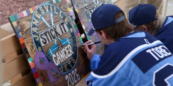 Two fans creating sign