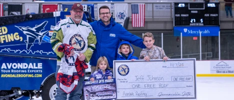 Family with donation check